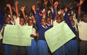 AP Photo by Stephen Wandera showing children in Uganda holding placards supporting the Anti-Homosexuality Bill and President Yoweri Museveni